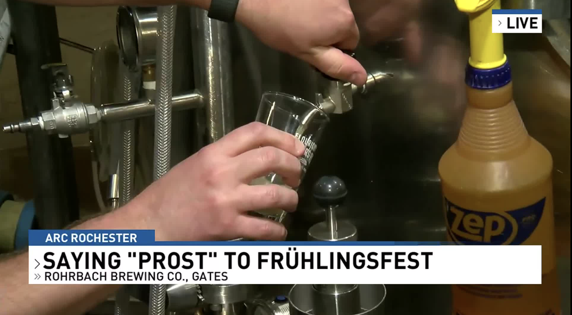 Beer being poured fresh from a tap during a live TV segment promoting Rohrbach Brewing Co.’s Frühlingsfest event in Rochester.