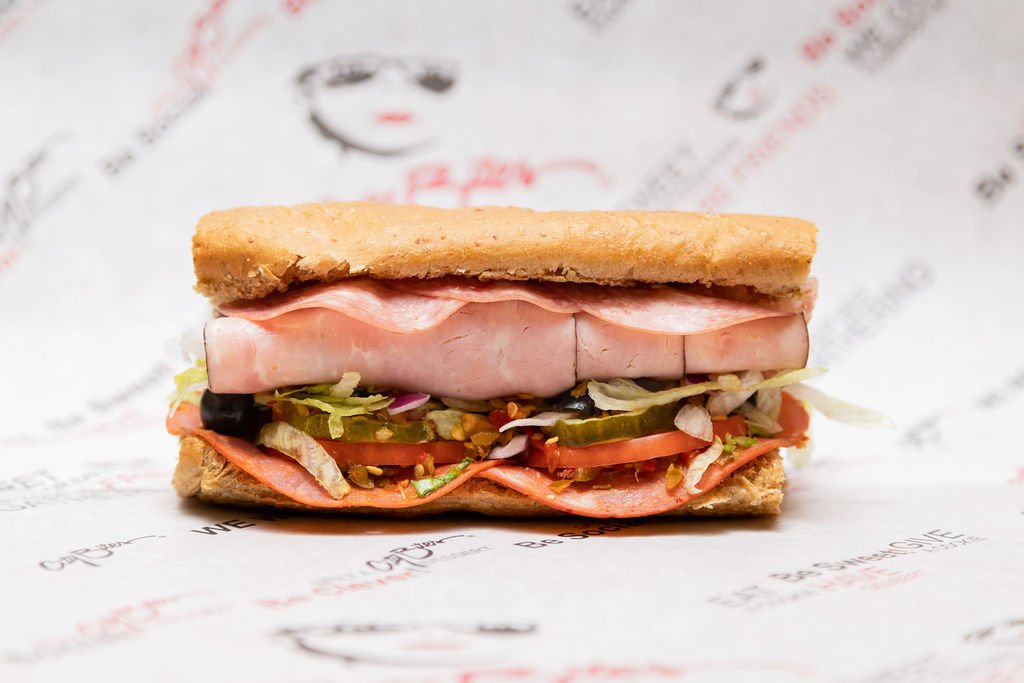   Italian   Ham, salami, capocollo, provolone, lettuce, tomatoes, red onions, pickles, black olives, crushed cherry peppers, blended oils, mayo, salt &amp; pepper. 