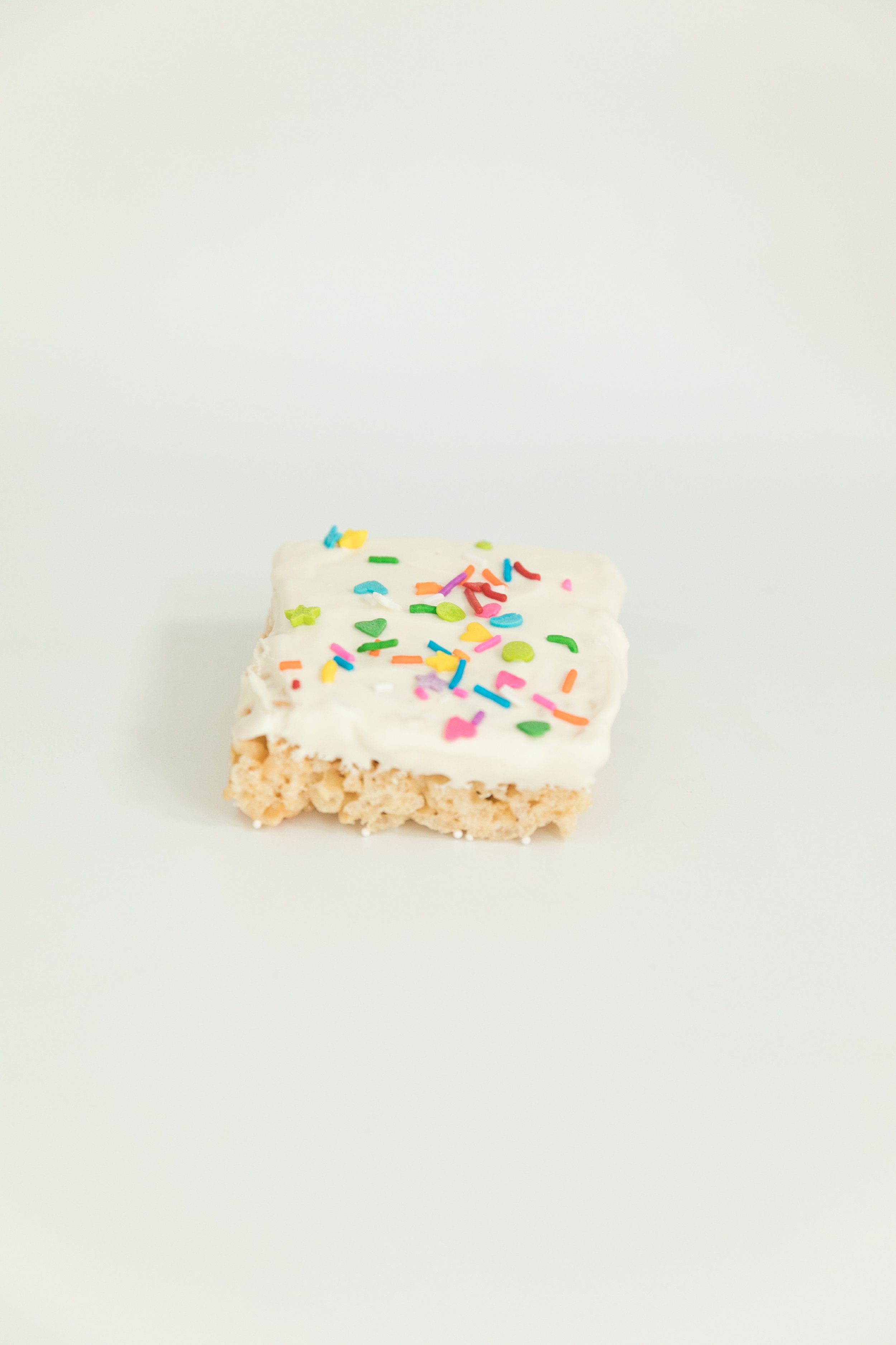  rice krispies treat dipped in white chocolate covered with sprinkles  