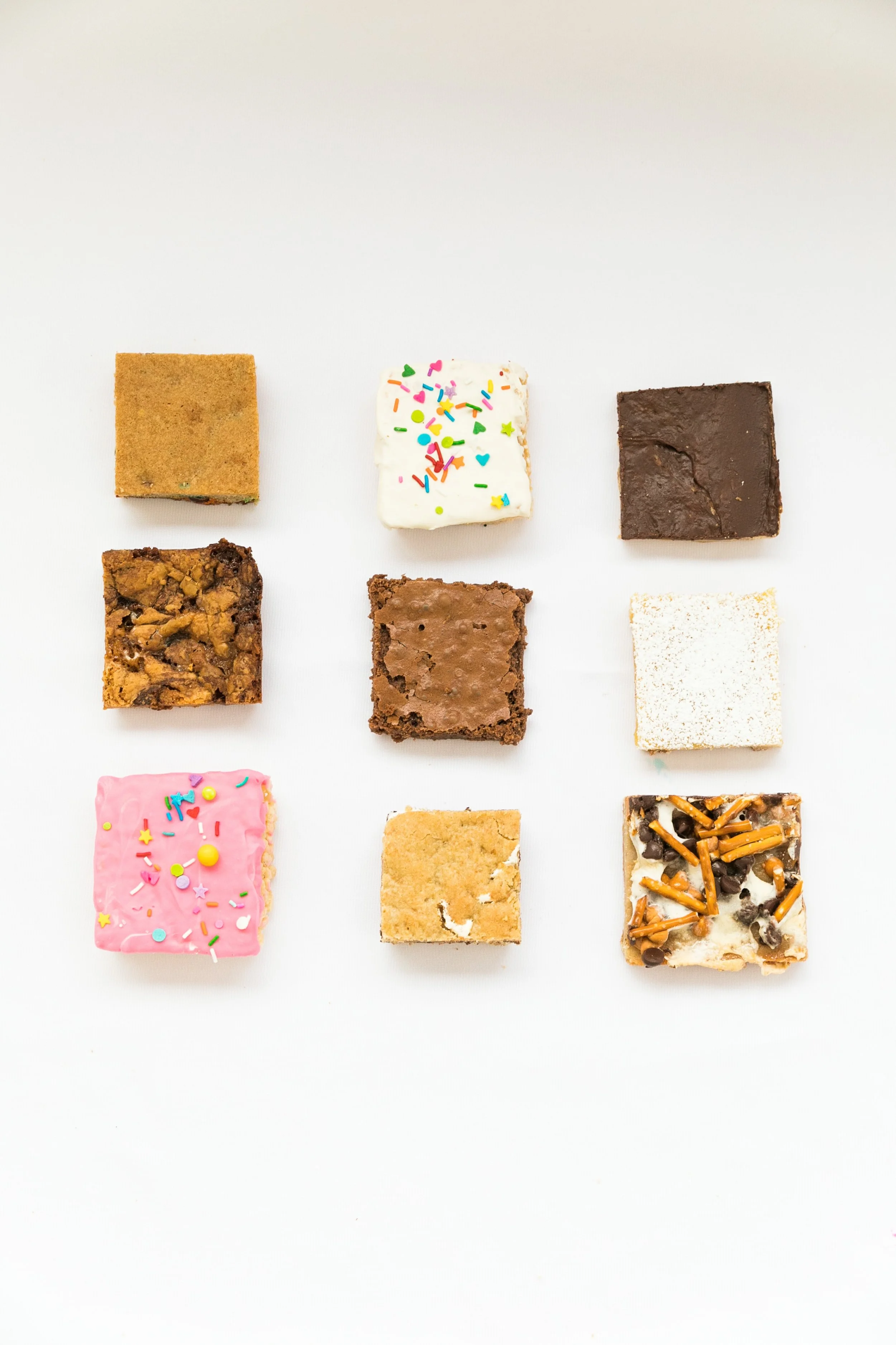 Delish bars in a variety of flavors with rice krispies treats, Marshmallow pizza bars, smores bars, and lemon bars