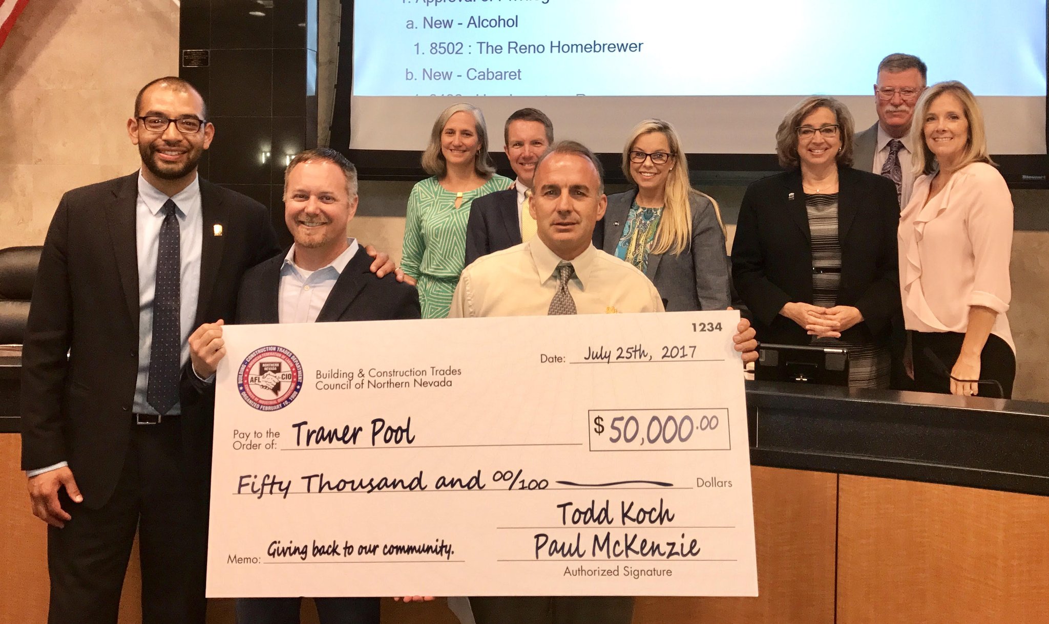 Members of Reno City Council and members of the Building and Construction Trades Council of Northern Nevada present a $50,000 donation for the new Traner Pool on Carville Dr in Reno.