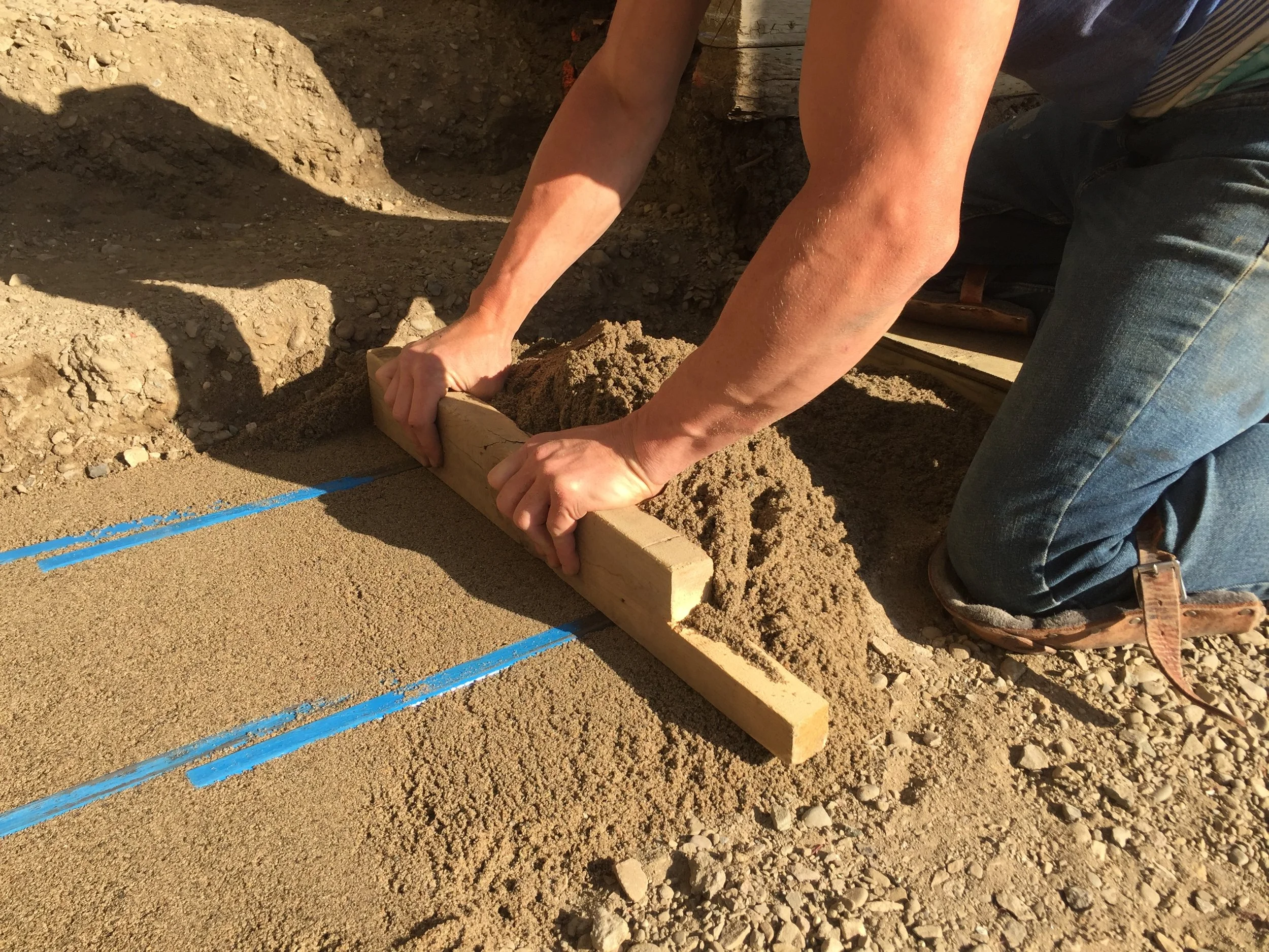 Screeding bars make for easy leveling of your bedding sand.