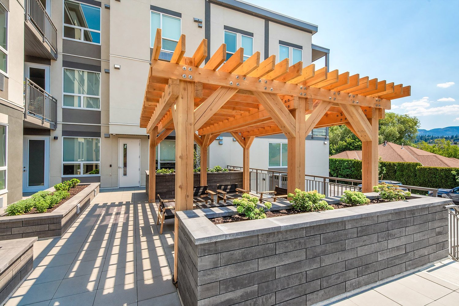 Use Dorado Wall to create raised planters that double as privacy screens around a gazebo