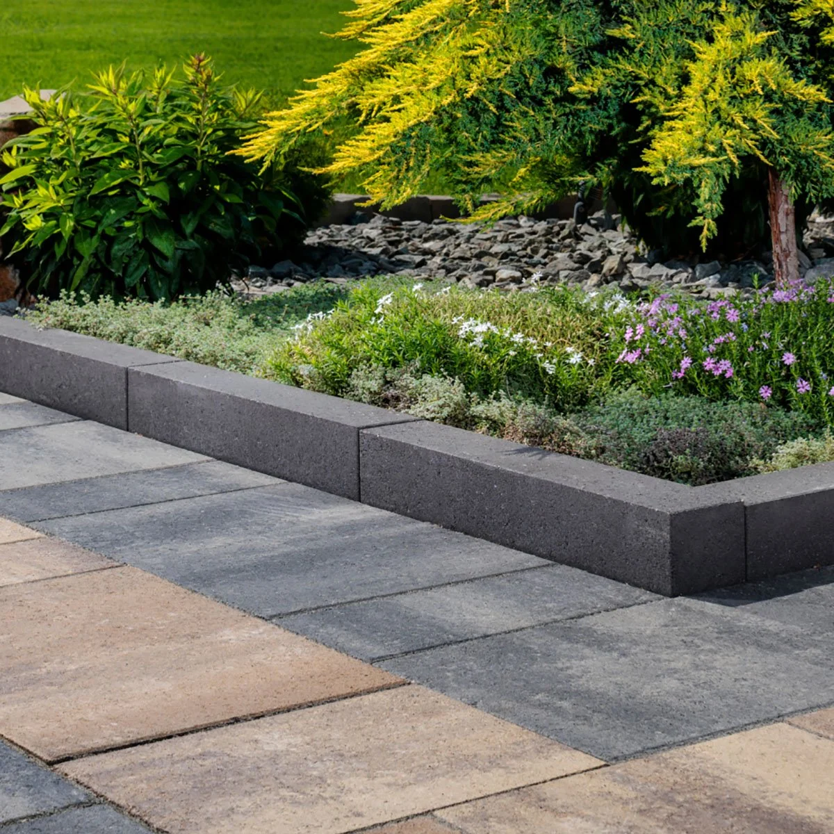 Edging restraint looks beautiful, holds pavers in place, and separates walkways from garden beds.