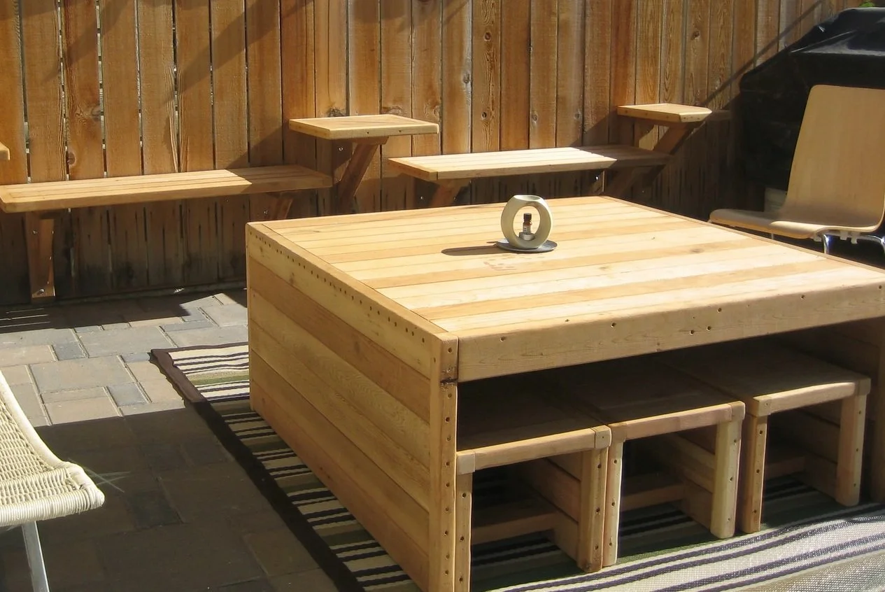 Custom modular wooden benches and tables create extra outdoor seating when needed.