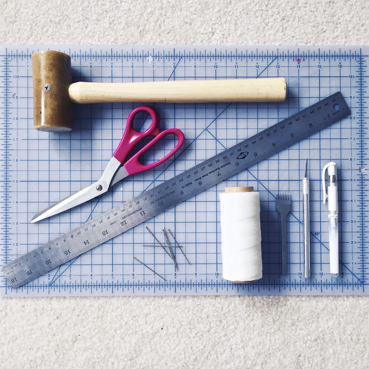 Waxed-nylon thread, chisel, rawhide mallet,&nbsp;X-Acto knife, white pen, leather needles, self-healing mat, fabric scissors, ruler