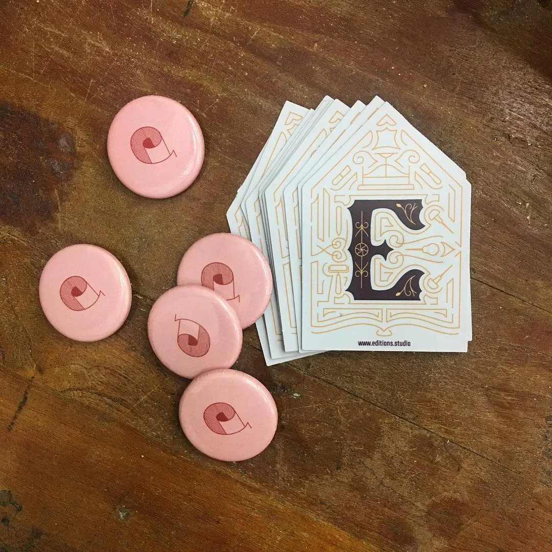 Editions+Business+Cards+and+Pins.webp
