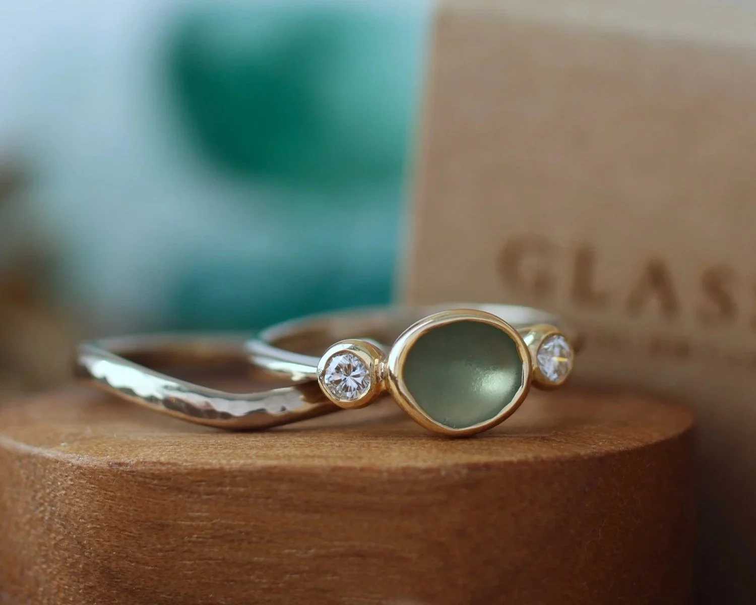 Thea Dinas sea glass ring on a wooden box