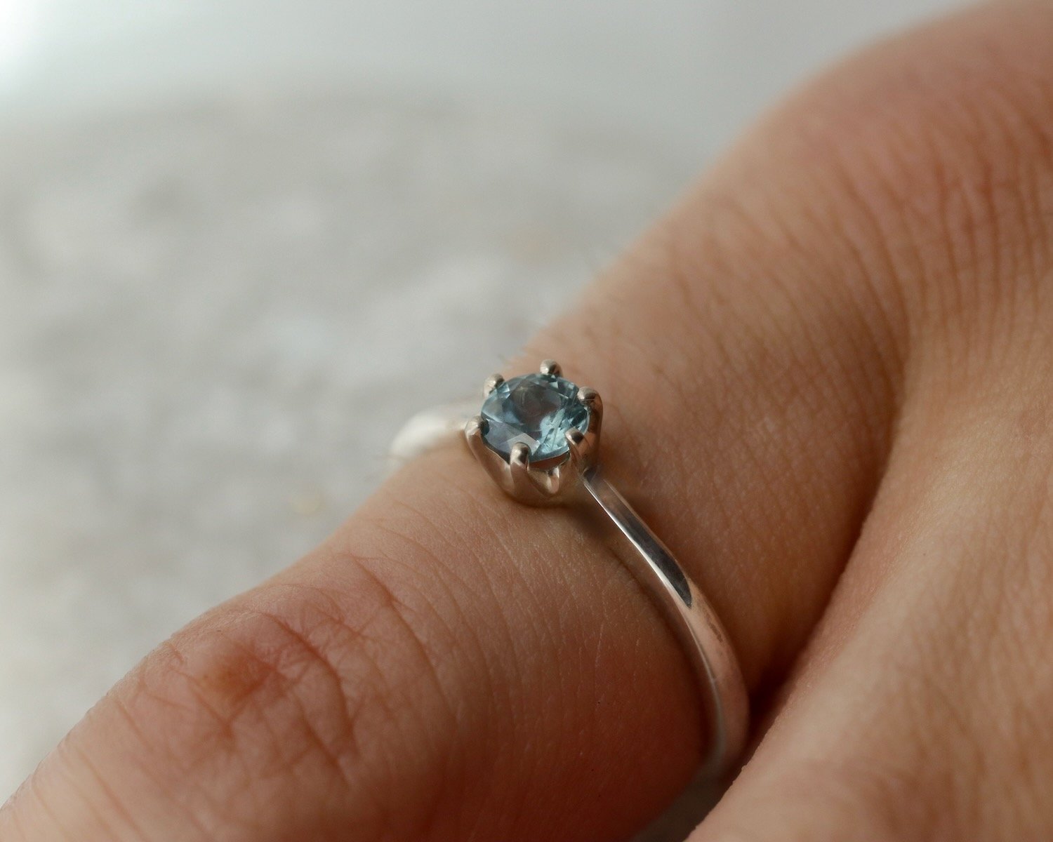 Glasswing-claw-set-sapphire-solitaire (1).jpeg