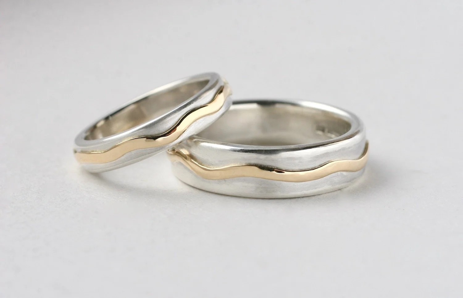 Escalls Wedding Rings Glasswing.jpeg