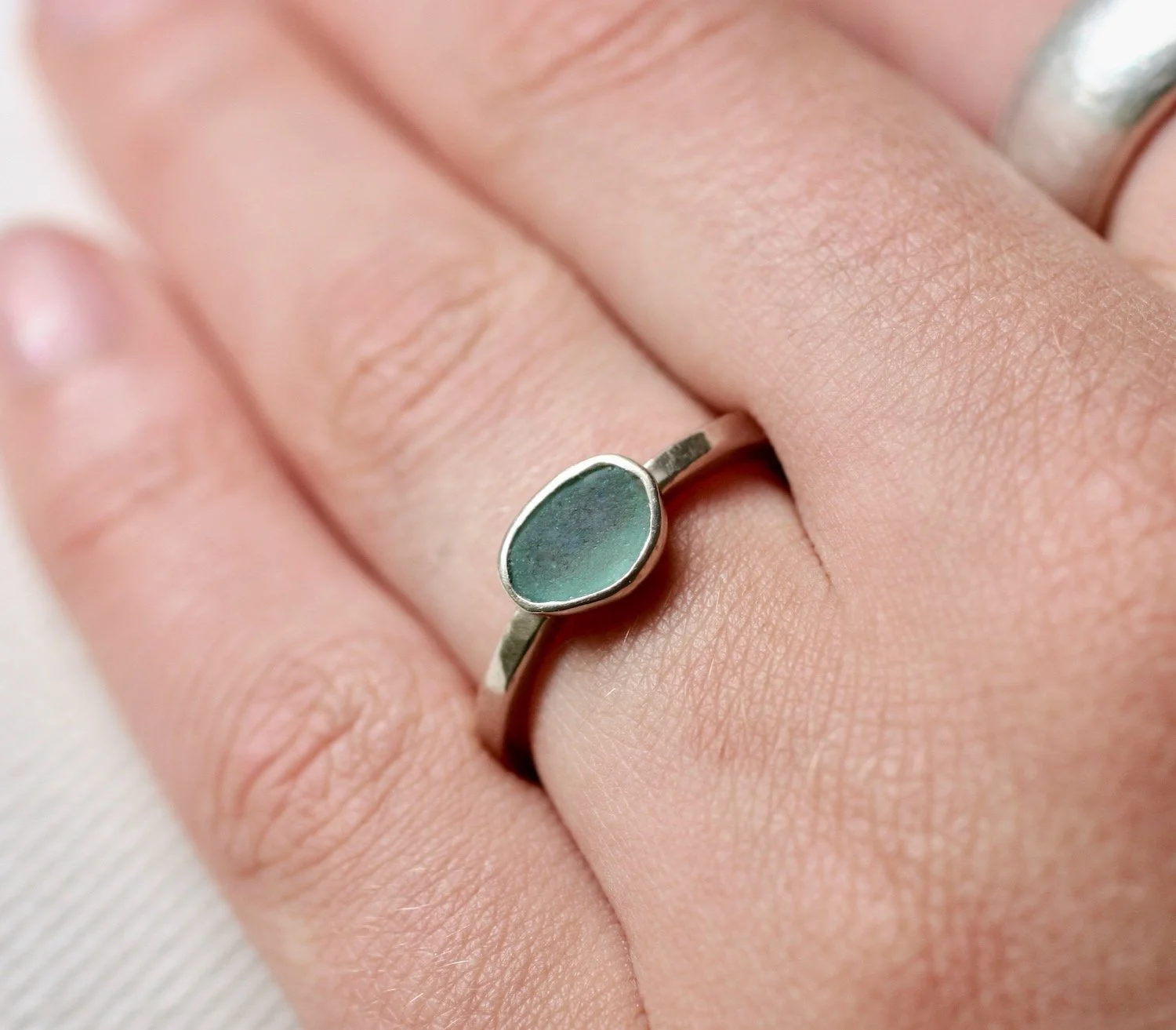 Sulis sea glass ring shown worn on a hand