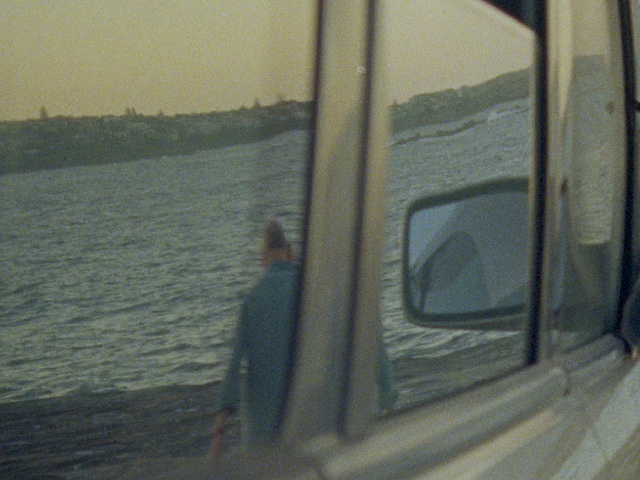 Reflected portrait of Lachlan Warner in car window, observational documentary cinematography by Elliott Deem