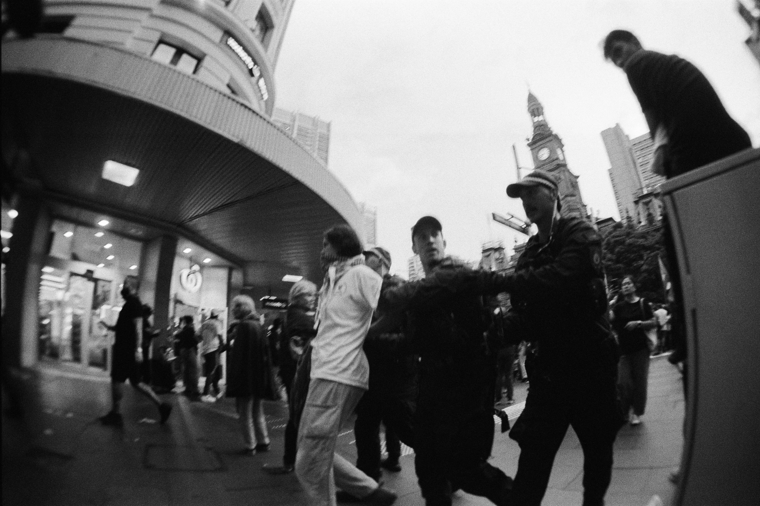 NSW Police officers detaining a protester during a demonstration in Sydney opposing the Australian visit of Israeli President Isaac Herzog — documentary photography by Elliott Deem.