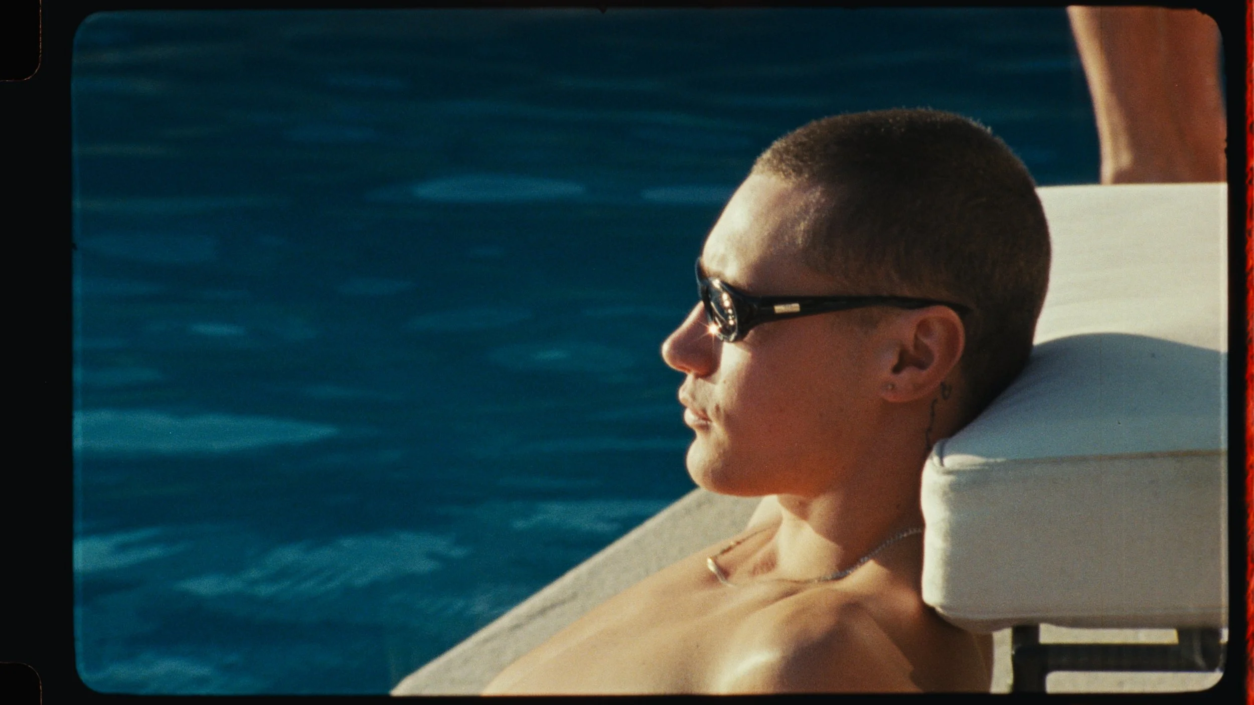 Close-up of drinking glasses in bright summer light, tequila brand detail shot with cinematic texture by Elliott Deem