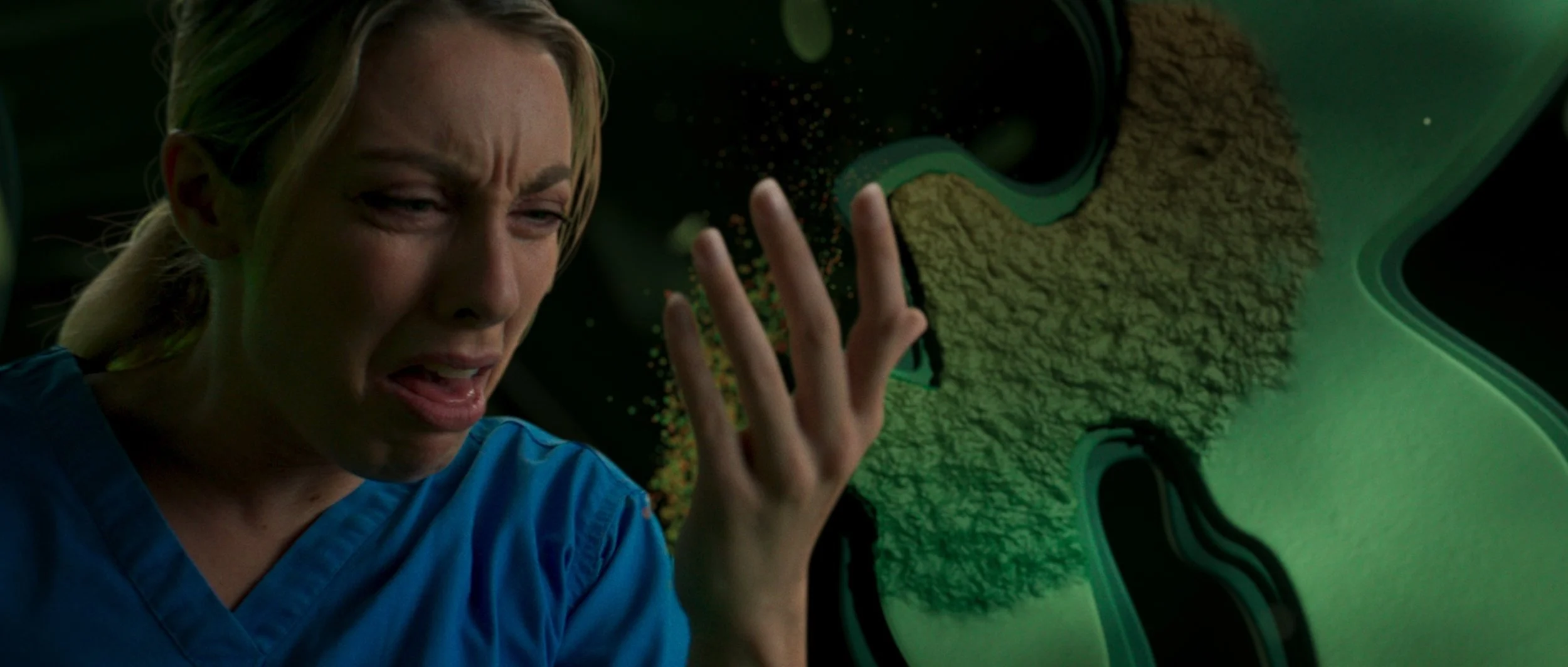 Healthcare worker reacting emotionally within a simulated biological environment in VFX-heavy medical technology commercial for Nanosonics