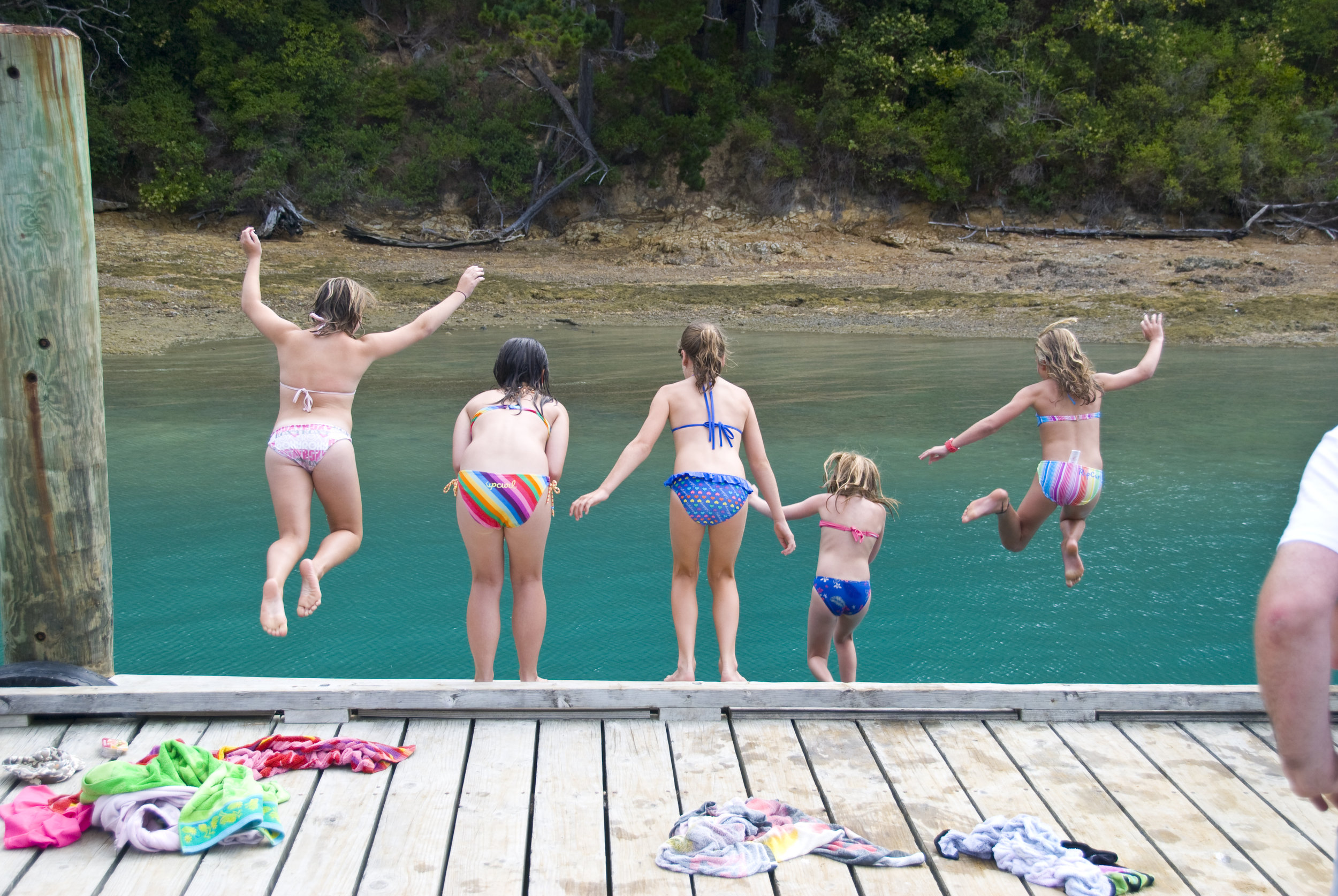 Kids jumping off the wharf