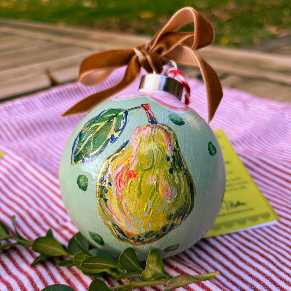The pear-fect hand-made gift to give this holiday! 🎄
This 3&quot; hand-painted ceramic pear ornament from my &Agrave; la table mini series is sure to delight. The backside has a hand-painted heart with Joie (Joy) on it.

Available at:
Crooked Tree M