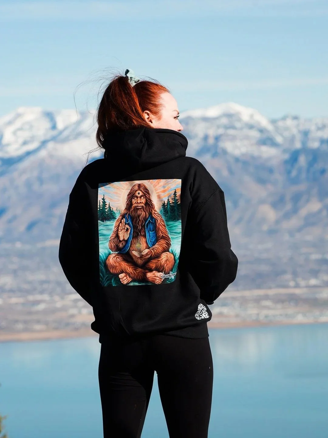 This is a black hoodie with an image of her painting Spiritual Sasquatch printed on it