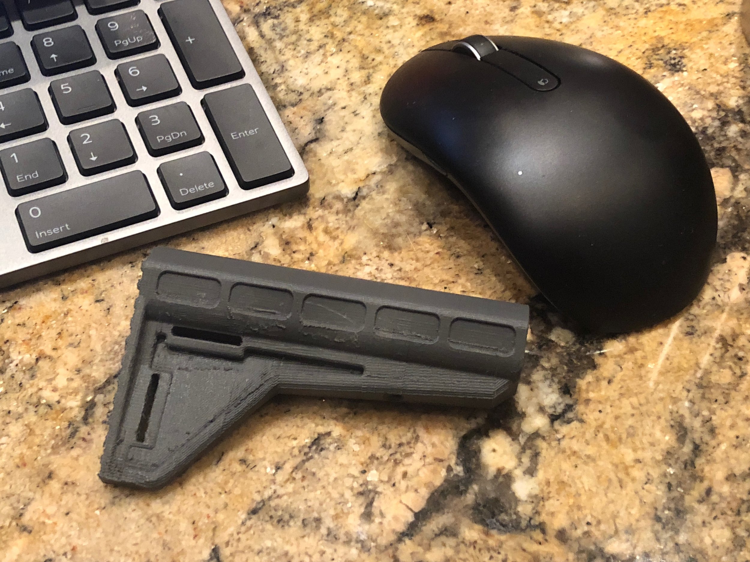 Here we created a baby version of a pistol stock so that our mouse wouldn't feel alone...