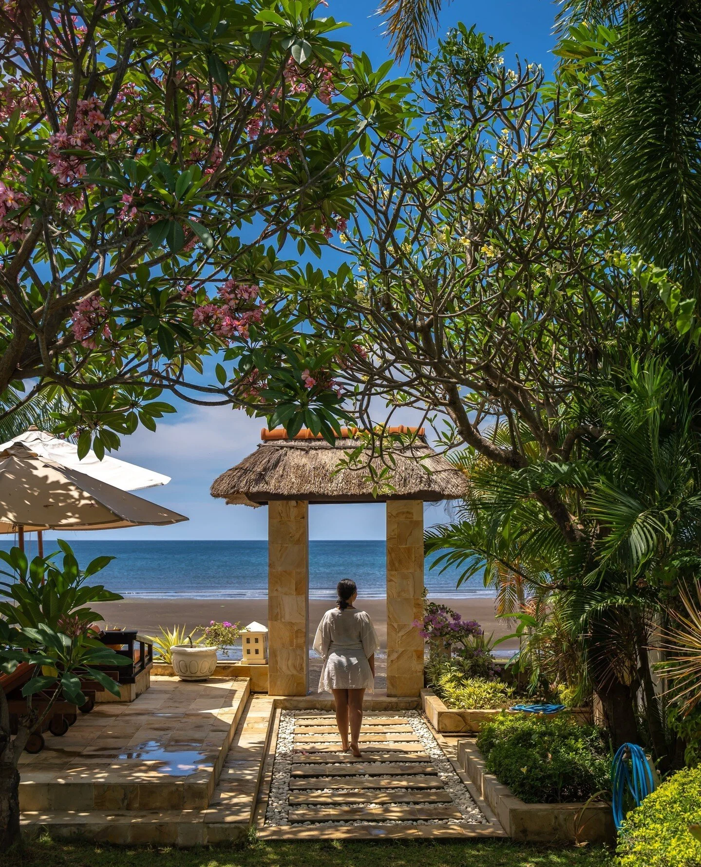 Stroll through paradise in style. 🌿 Make your way through the lush garden at The Villas, en route to the breathtaking black volcanic sands of Lovina Beach, just steps away.⁠
⁠
The Villas' garden has been a labour of love, flourishing into a captivat