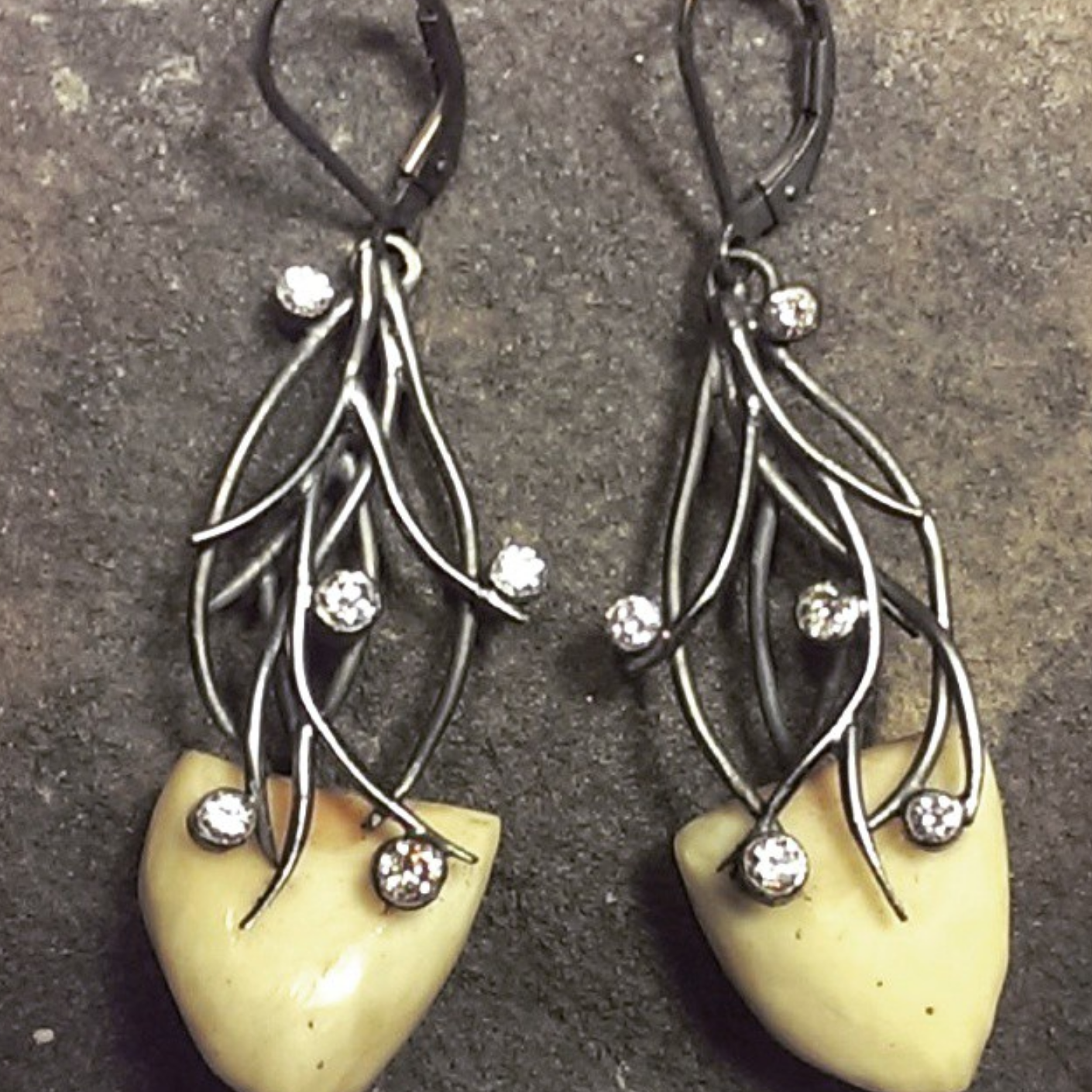 For a travelling nurse, earrings of polar bear teeth (legally obtained and gifted to her), a dark antler motif, and star-like diamonds. A tribute to the ever-dark winters she spent with the indigenous population above the arctic circle.