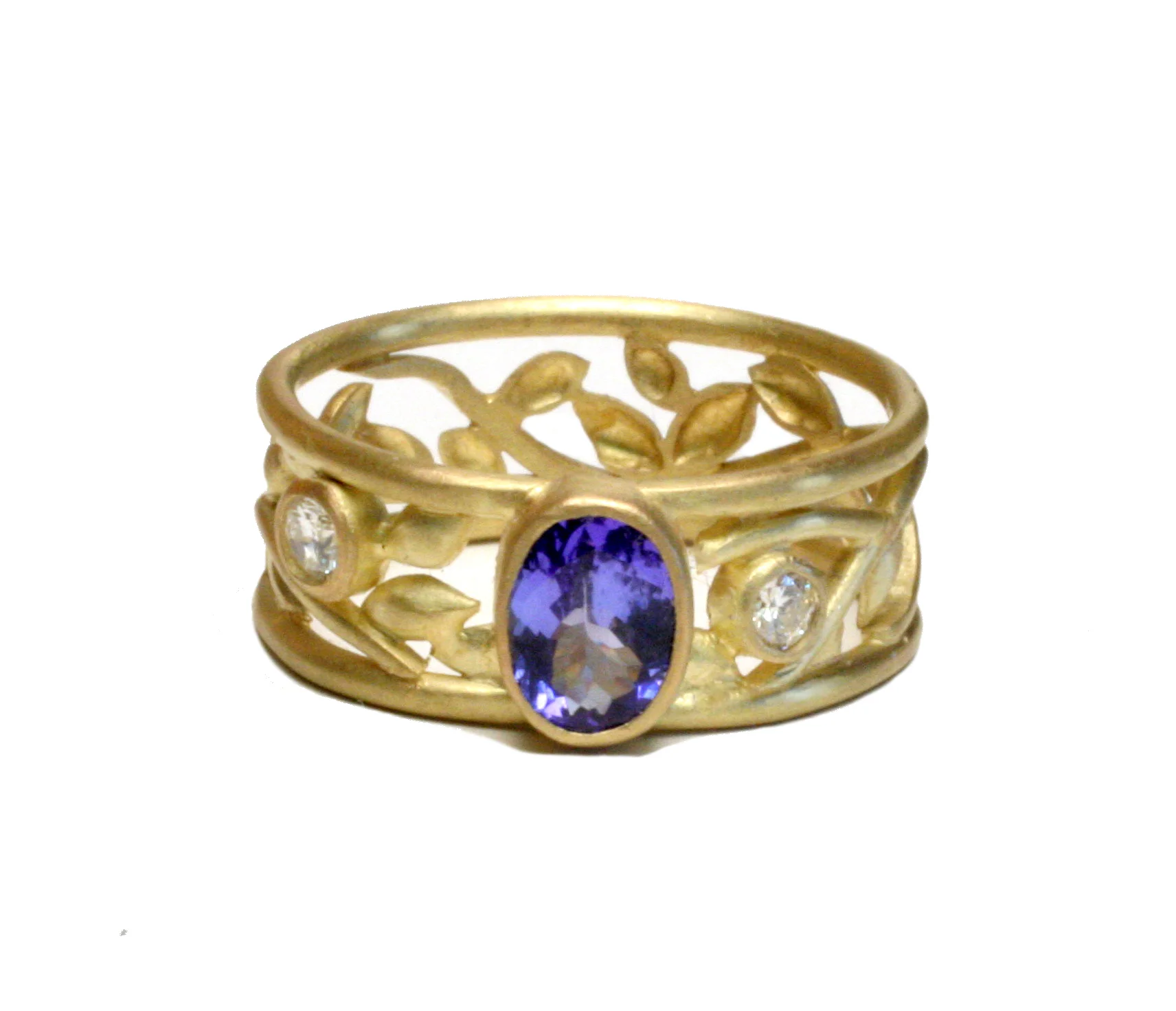 The directive was to liberate this tanzanite from a generic piece of commercial jewelry stuffed in a drawer. Having come to life from that bland setting, this gem now adorns the finger of the owner every day.