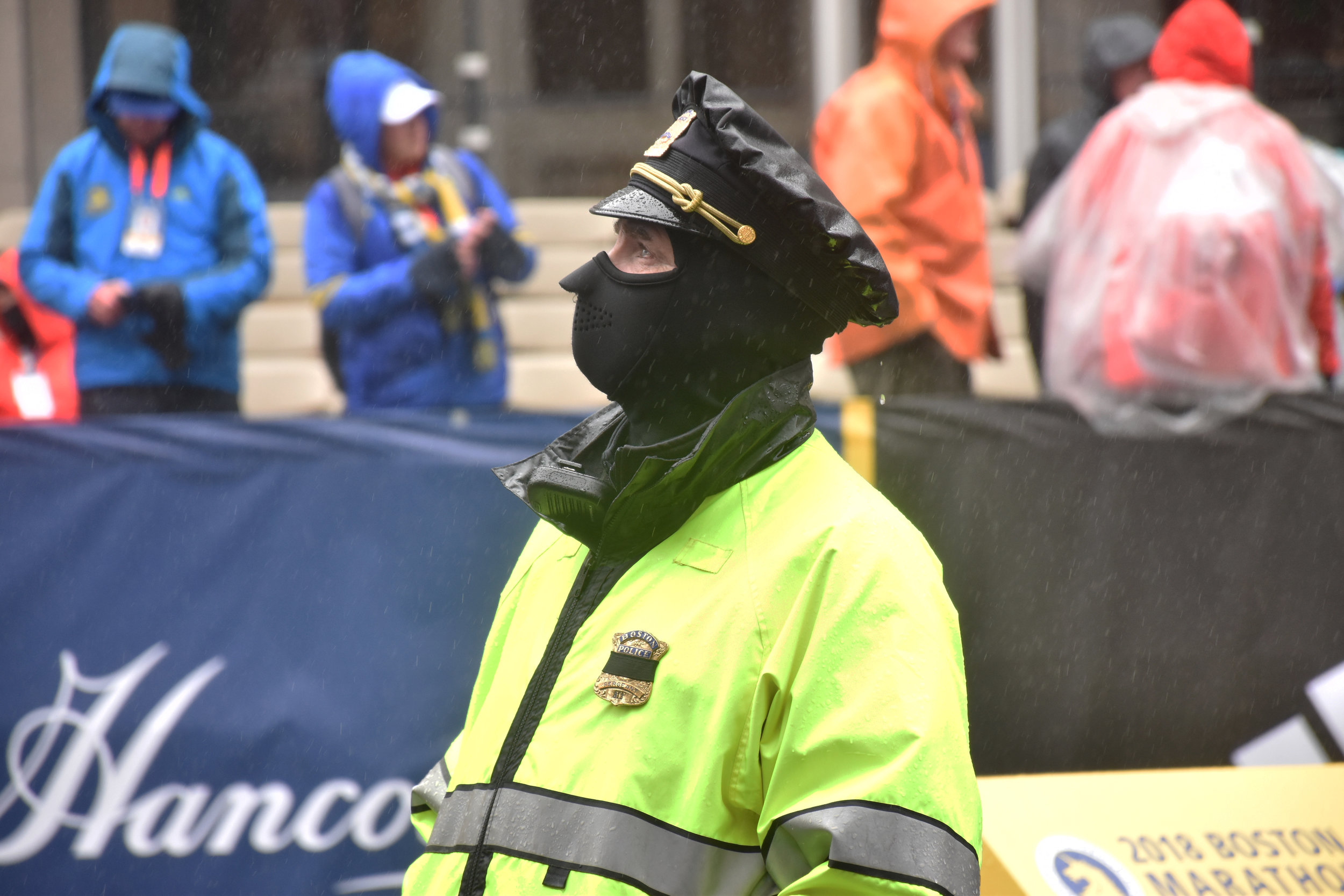 A police officer surveys the Boston Marathon finish line