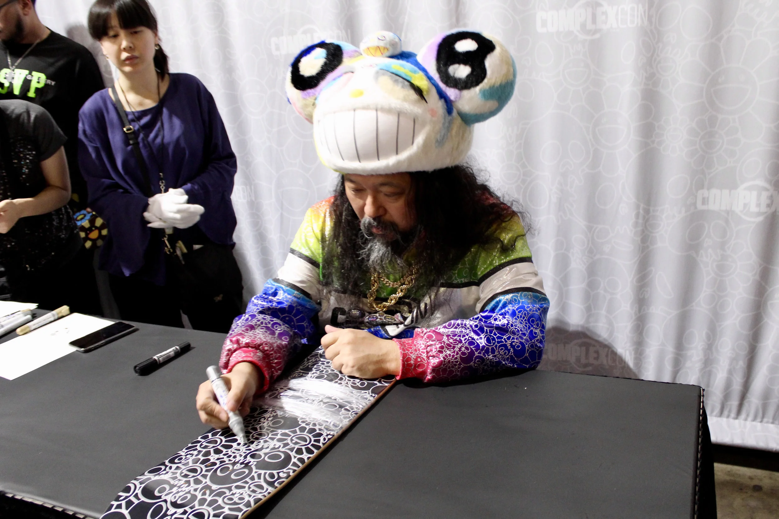 Takashi Murakami signing our deck