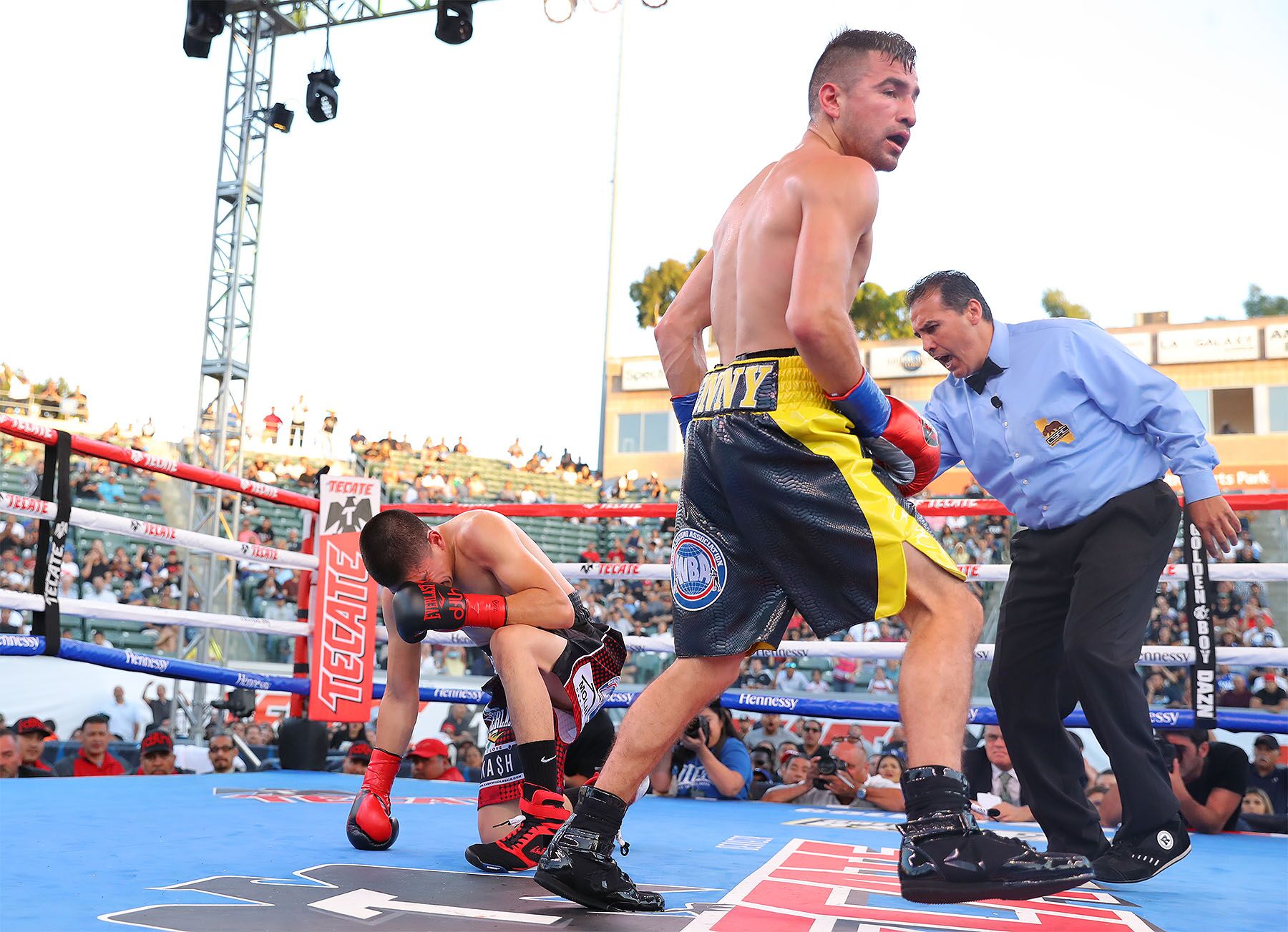 Diego De La Hoya on his knee from a Ronny Rios right hand by Tom Hogan/ Hogan Photos