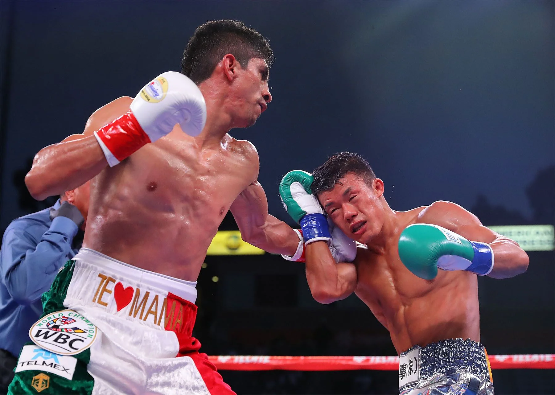 Rey Vargas lands a left hook on Tomoki Kameda by Tom Hogan/ Hogan Photos
