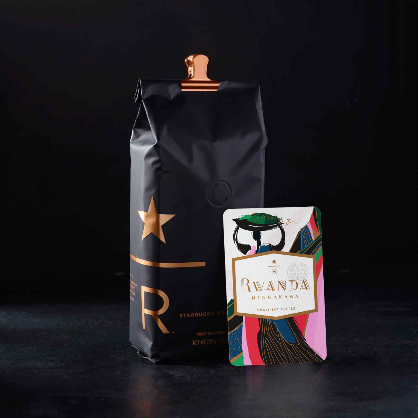Farmer’s Story A group of farmers known as Hingakawa— all of whom are women —are turning out coffees of rare elegance. After bearing witness to one of Rwanda’s darkest episodes, the farmers of Hingakawa found a path forward through coffee—one that embraces reconciliation, revitalization and improved livelihoods. Hingakawa, a mantra that translates to “Let’s grow coffee,” is a product of patience, care and love. Artist’s Story I still can’t believe that this association is made entirely of women in a historically male dominated country. Because of that I knew I had to have HER – the female farmer – at the forefront of my art. The basket represents the idea that Rwandan women are a strong, tightly woven unit, bringing stability to their economy and keeping their families bound together. Her dress mimics the valley and mountain behind her as a nod to her new craft; by harvesting nature in the form of coffee beans, she is rebuilding her nation literally from the ground up. I wanted this card to feel vibrant and powerful - just like her.