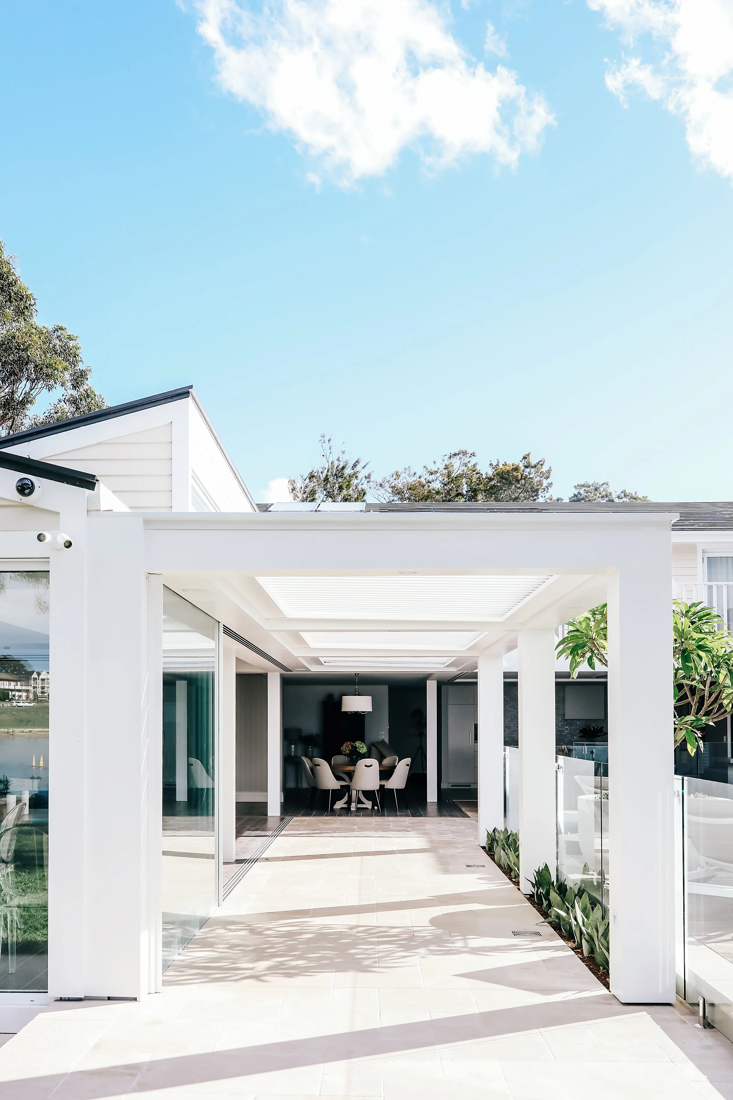 Bespoke designed awning, limestone tiling and pool area.