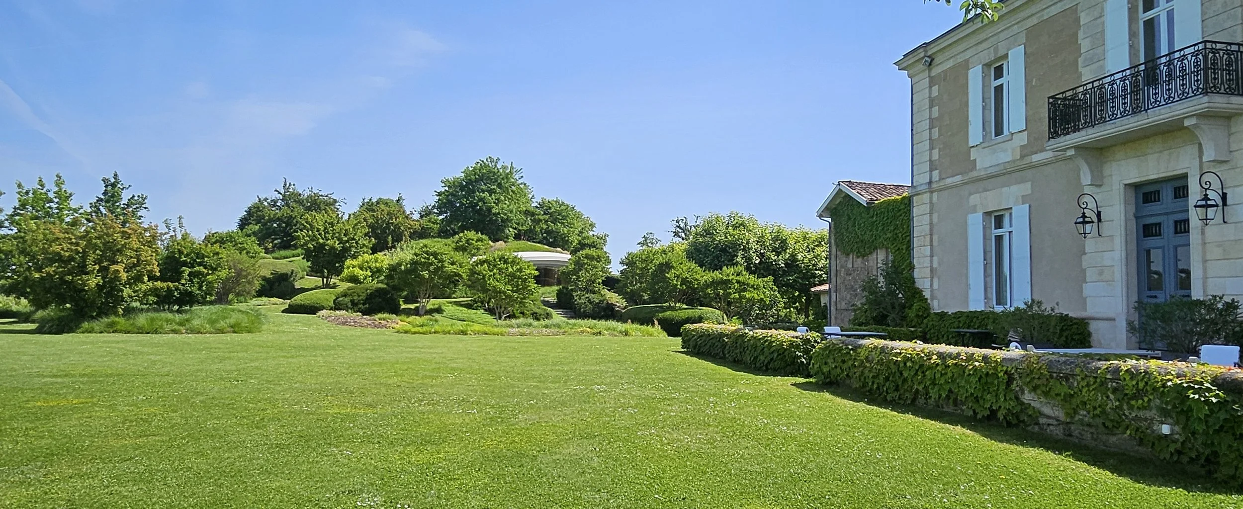 5.2.3 Friday 22 May 2026 Ch Haut Bailly - rear of chateau & view towards cellar .jpg