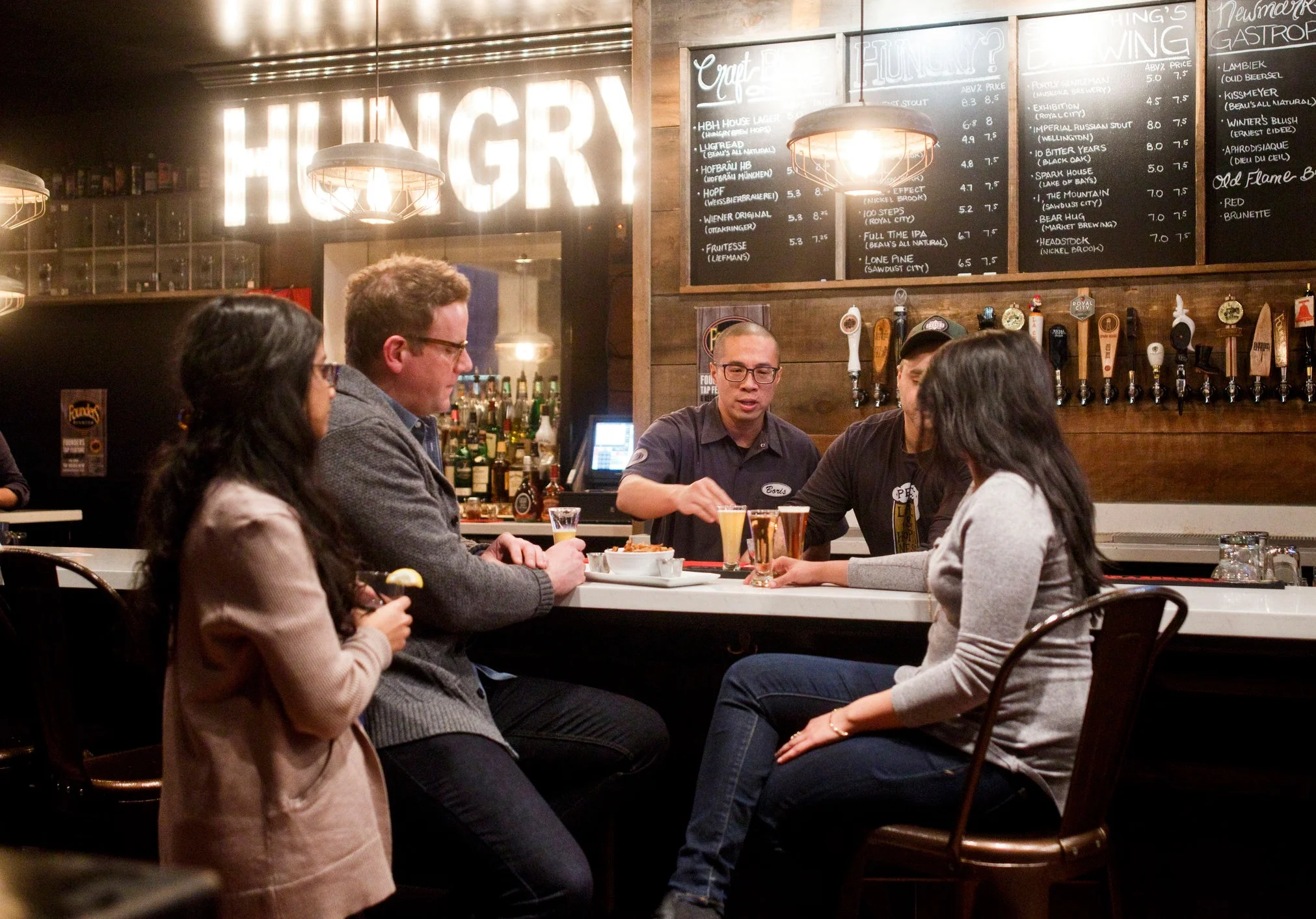 Owner of Hungry Brew Hops, and two other restaurants in the downtown, Boris Fong- serving up snacks and beverages.