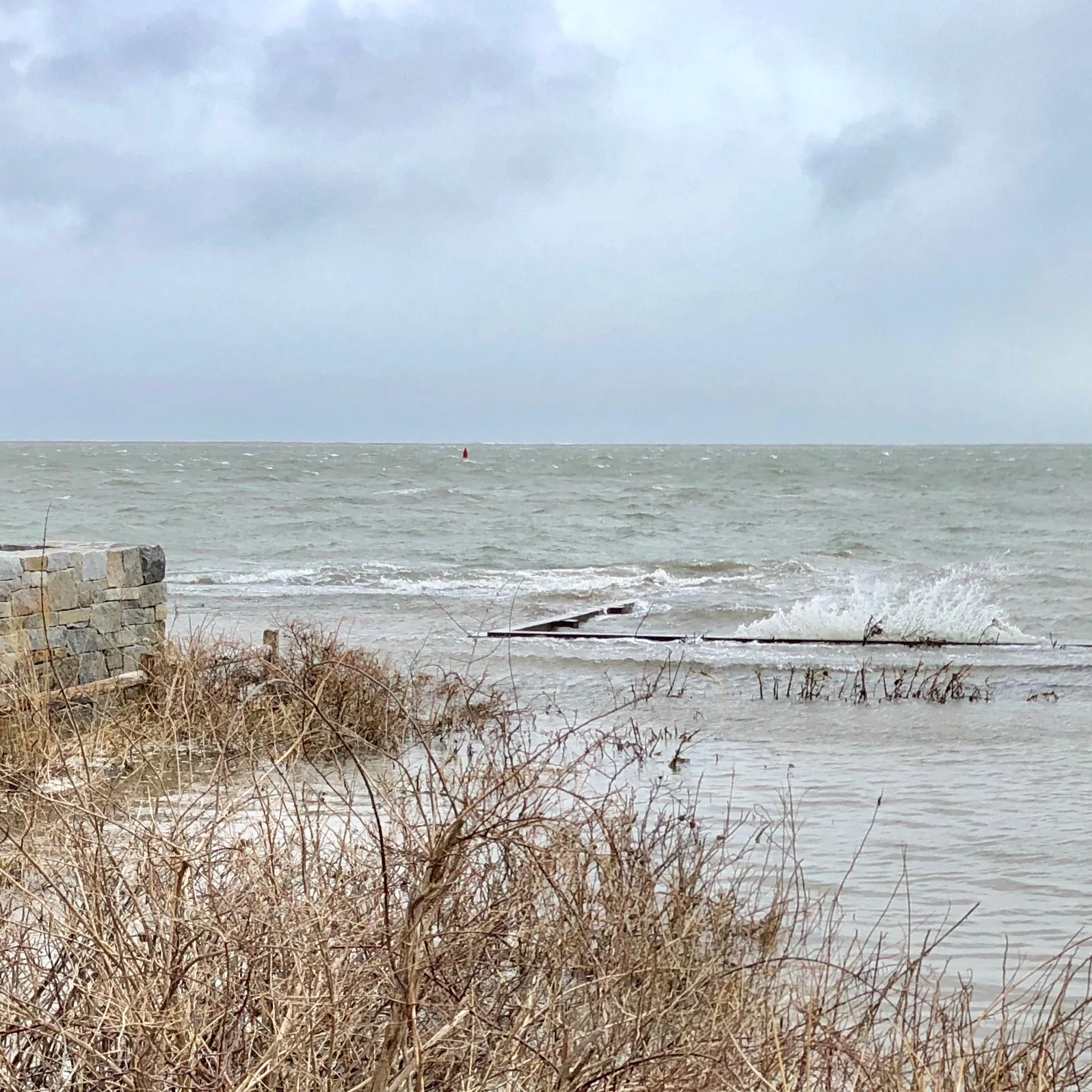 Our neighbor's beach in front at 42 Winsor Street. Tides are still running high, as is the wind.