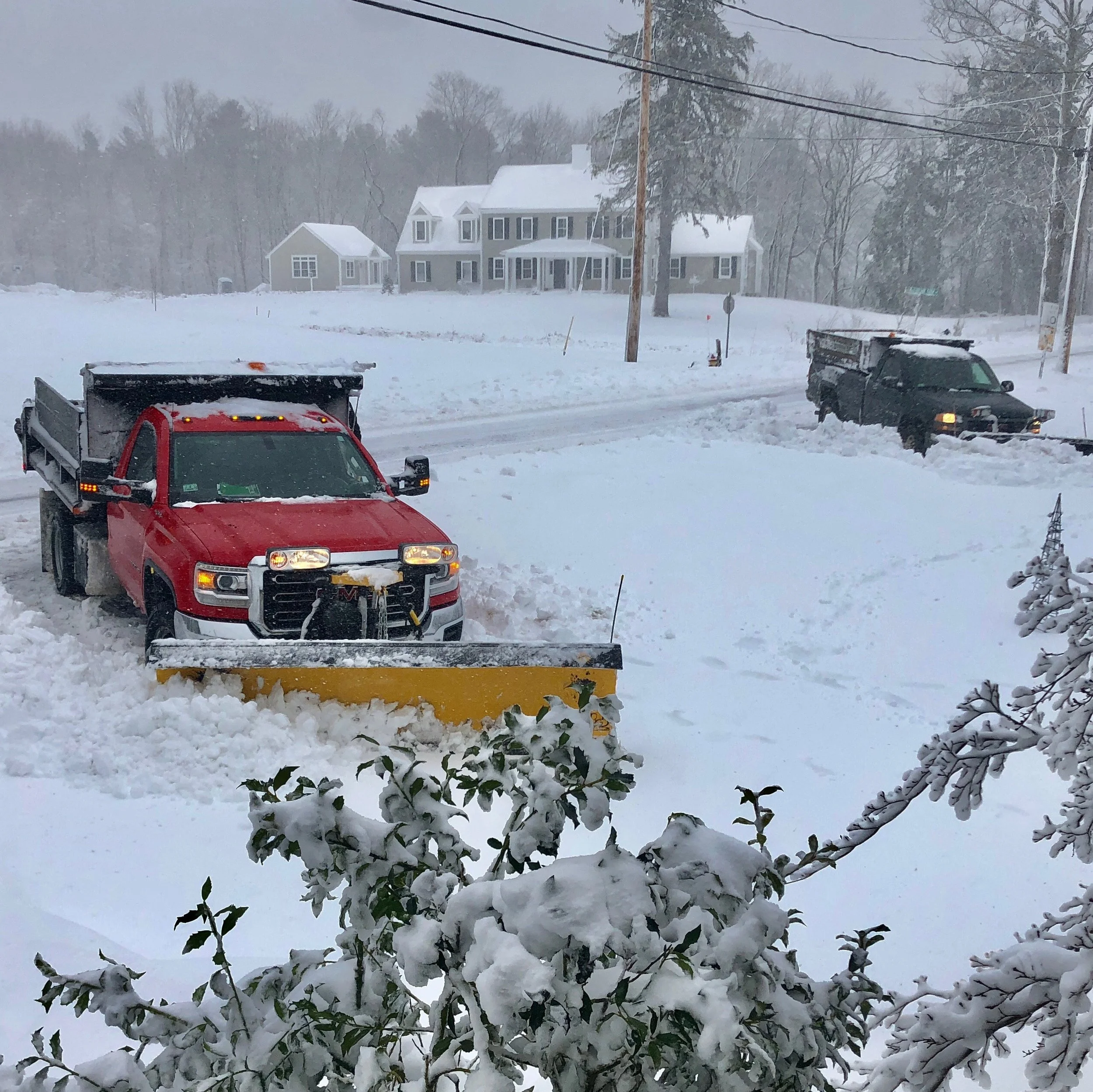 5:00 PM - the snow is so thick and heavy that these two plows got stuck in our "U" driveway