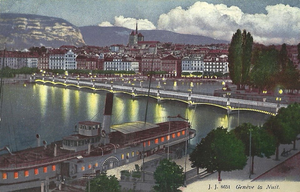 Vintage Postcard of Geneva with a view of the Mont Blanc Bridge, Lac Léman, a paddle boat, the Old Town and the Salève in the background by night.