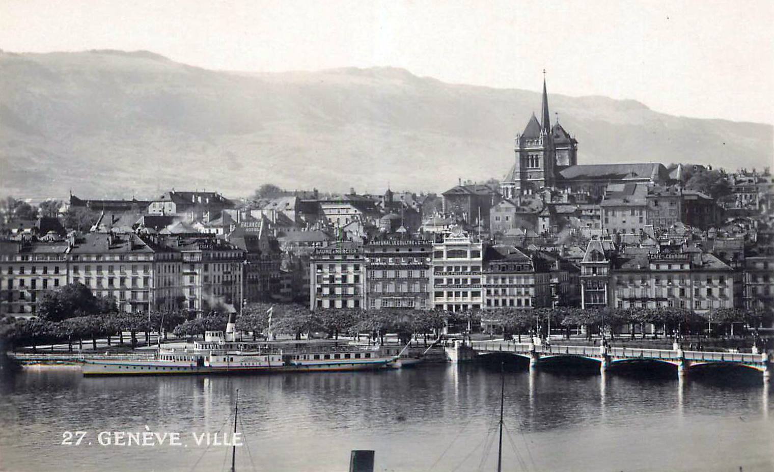 Vintage postcard of Geneva with a view over the Old Town and Cathedral de St Pierre with in the background the Salève; in black and white.