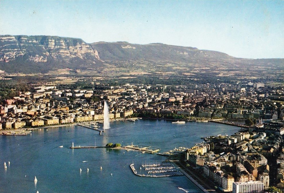 Vintage postcard of Geneva with an aerial view over Lac Léman, the Jet d’Eau and the Salève.