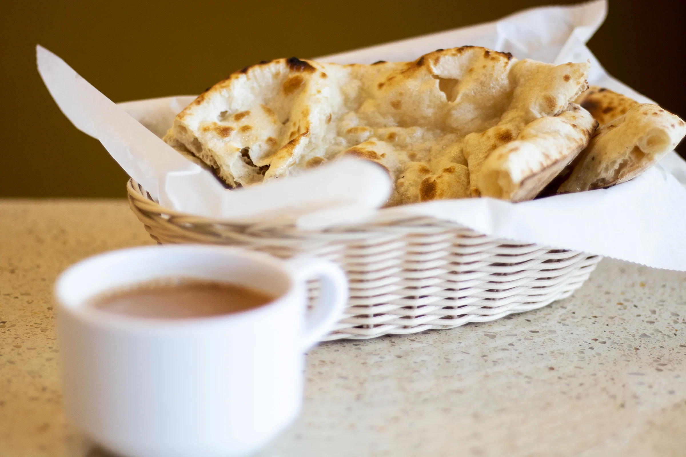  This photograph of chai tea and naan bread was taken for the Indian restaurant ”Spice and Rice.” This photography was used for their new website.    I styled the shoot, took the photographs, and edited them. 