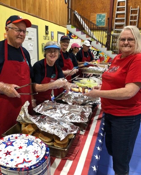 MCH volunteers serve with a smile.