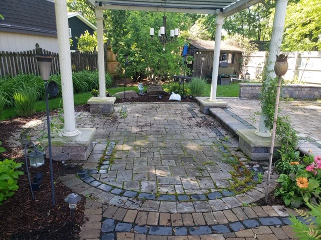 Before: patio, pillars, and walls