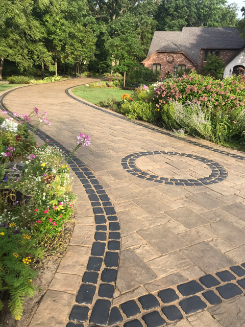 After: brick drive life and colors brought back, new jointing sand