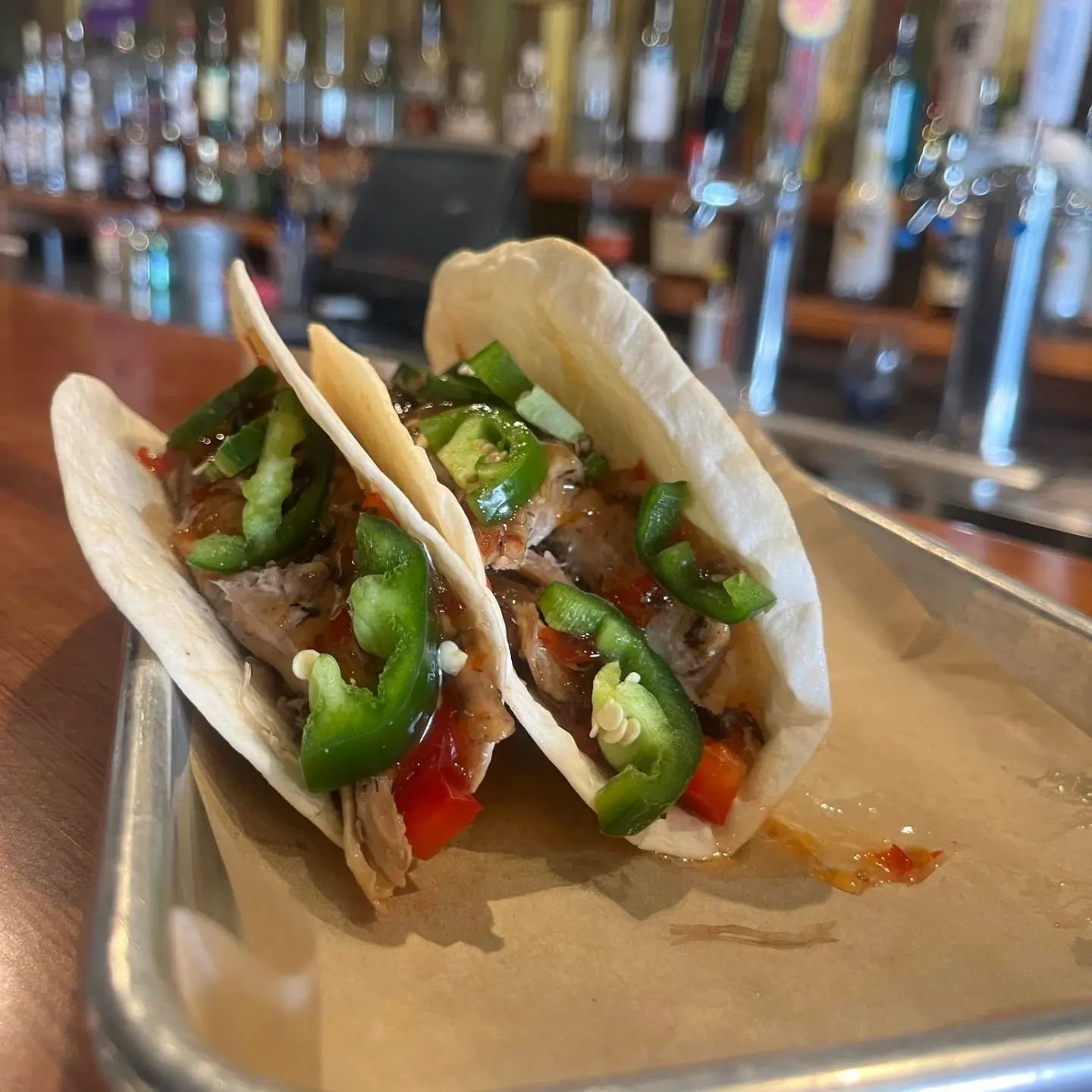 Pork n Peppers! Sweet n spicy! Pulled pork tacos on a bed of sweet bell peppers topped with fresh jalape&ntilde;os, drizzle on some sweet chilli sauce to tie it all together!