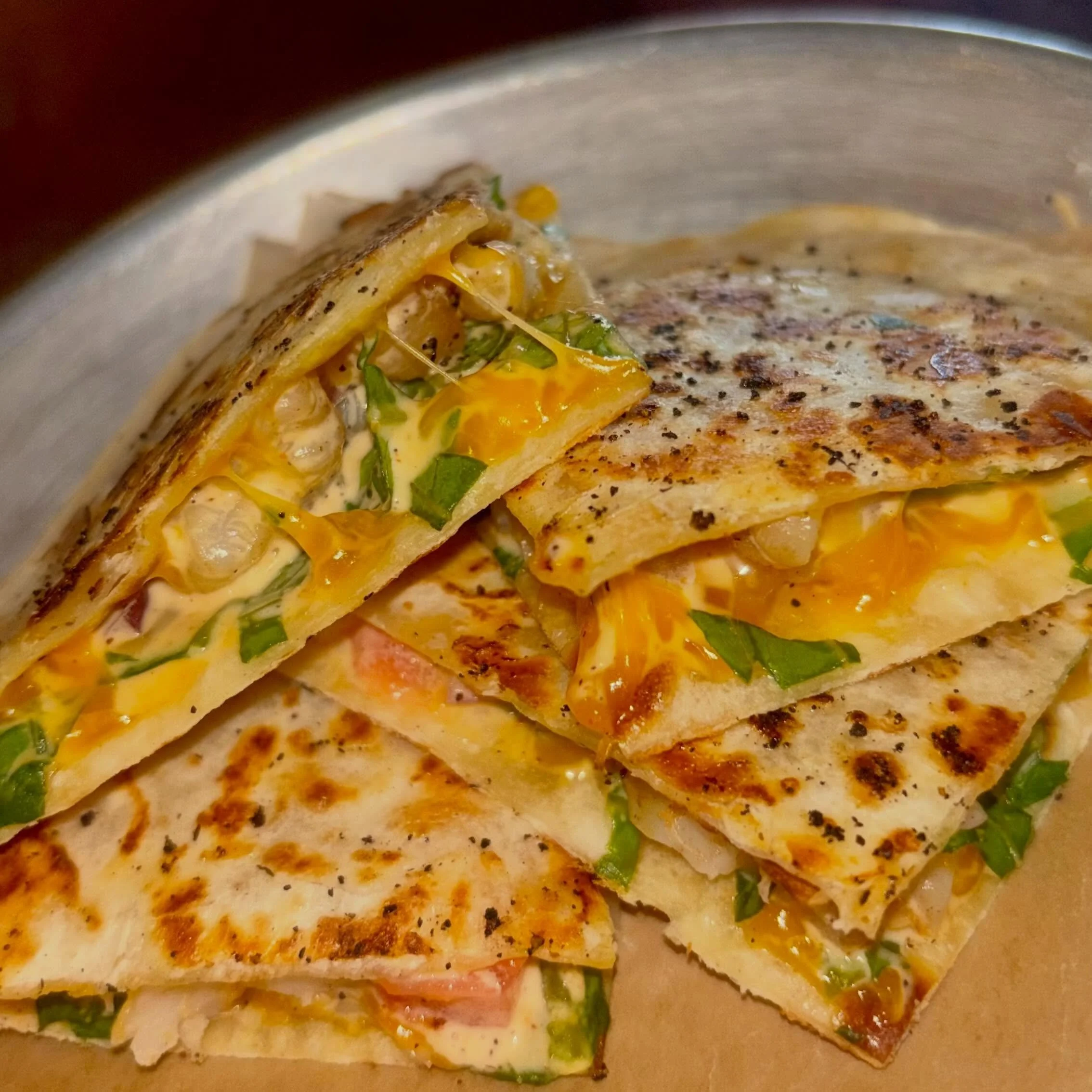$3 Quesadilla Tuesday! Grilled shrimp quesadilla with lettuce, onion, tomato, cheddar &amp; a Sriracha aioli. I mean, just look at that thing 🤤 Happy Hour from 4-6! #quesadilla #quesadillatuesday