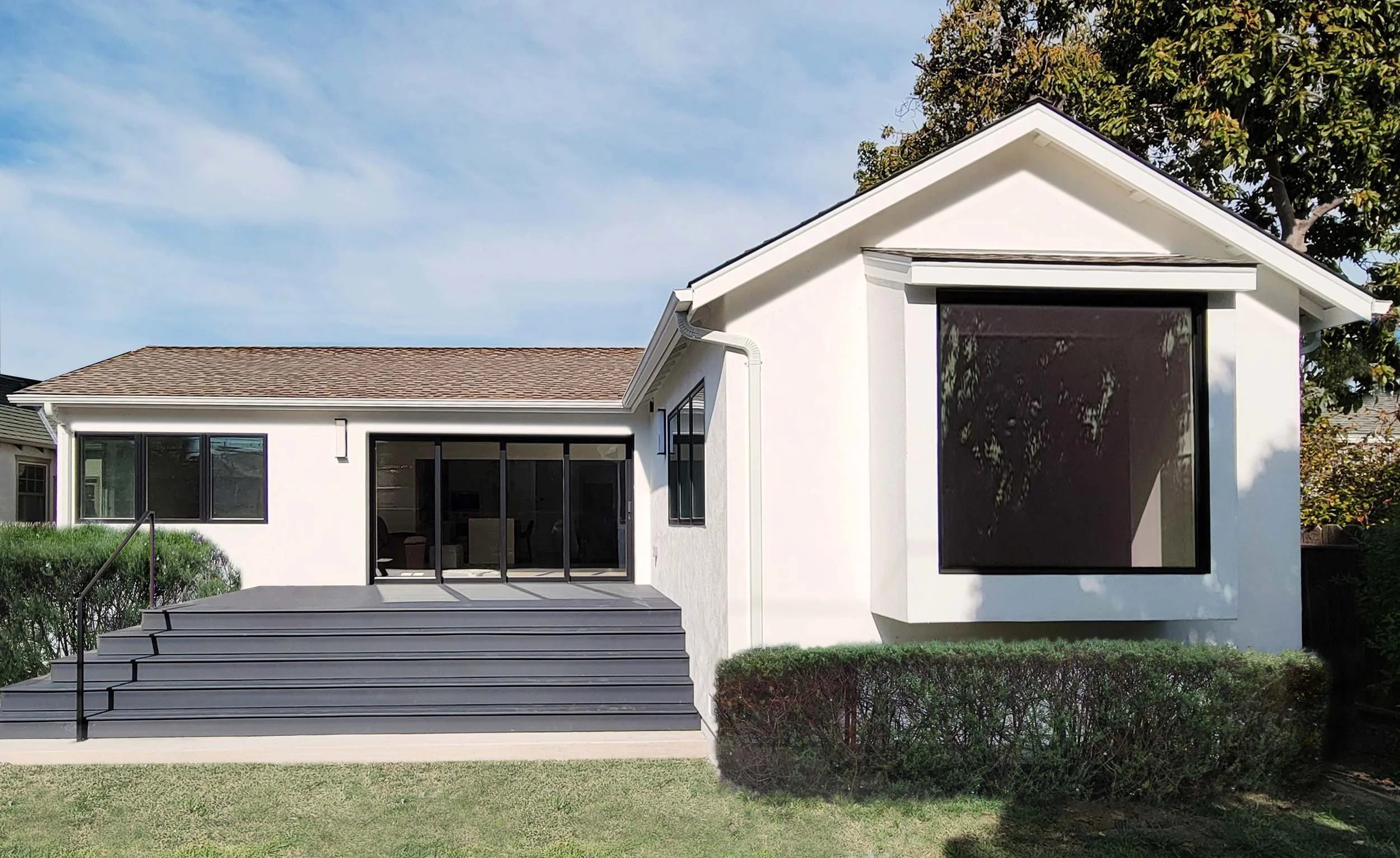 white-stucco-gray-deck-bay-window-tree.jpg