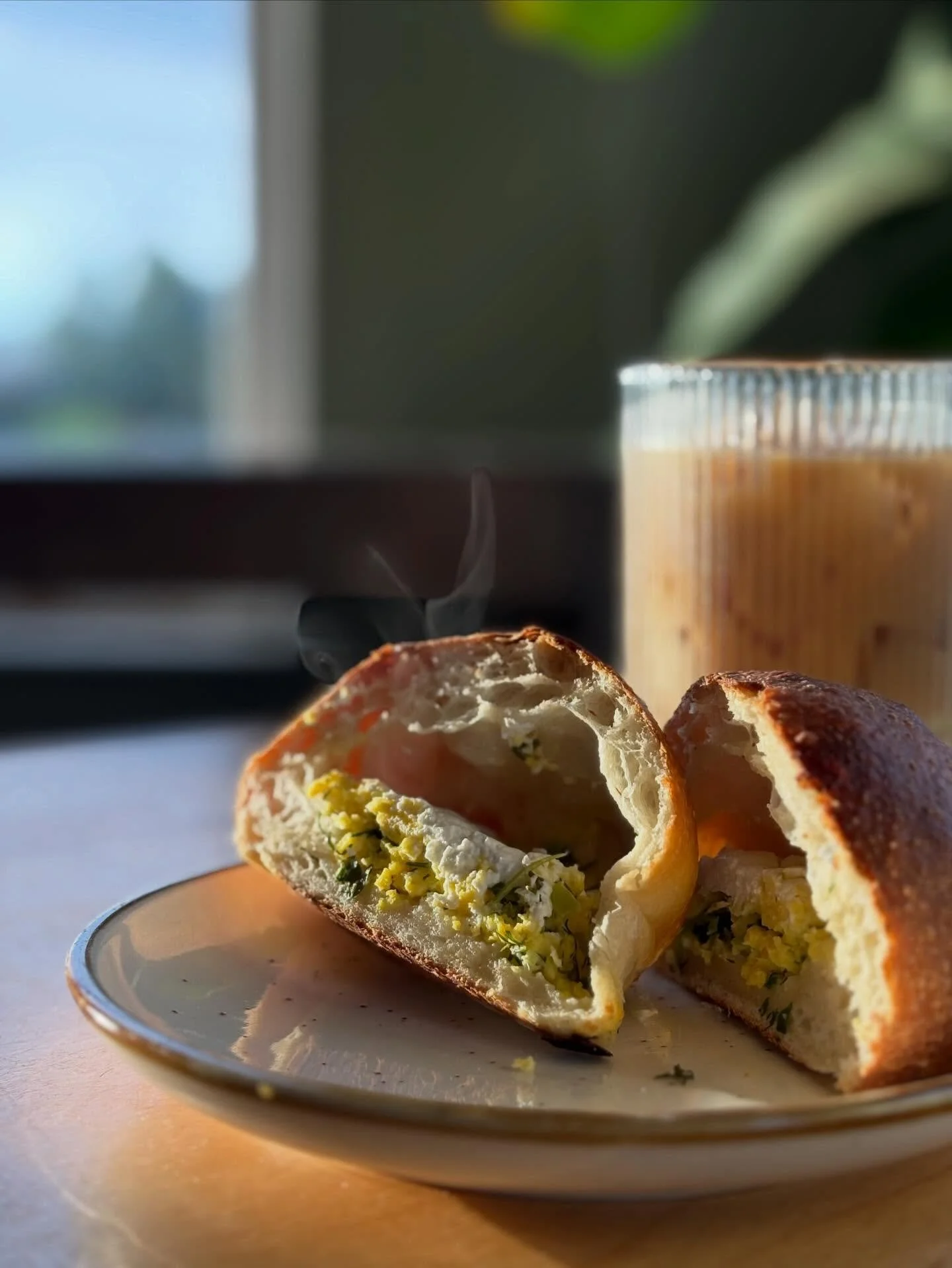 Same price as a corporate chain. Different everything else.

$12 gets you breakfast at both places.

At the corporate chain:
* Mass-produced food made off-site
* Shareholders get the profit
* Workers have no ownership stake. 
* Ingredients shipped fr