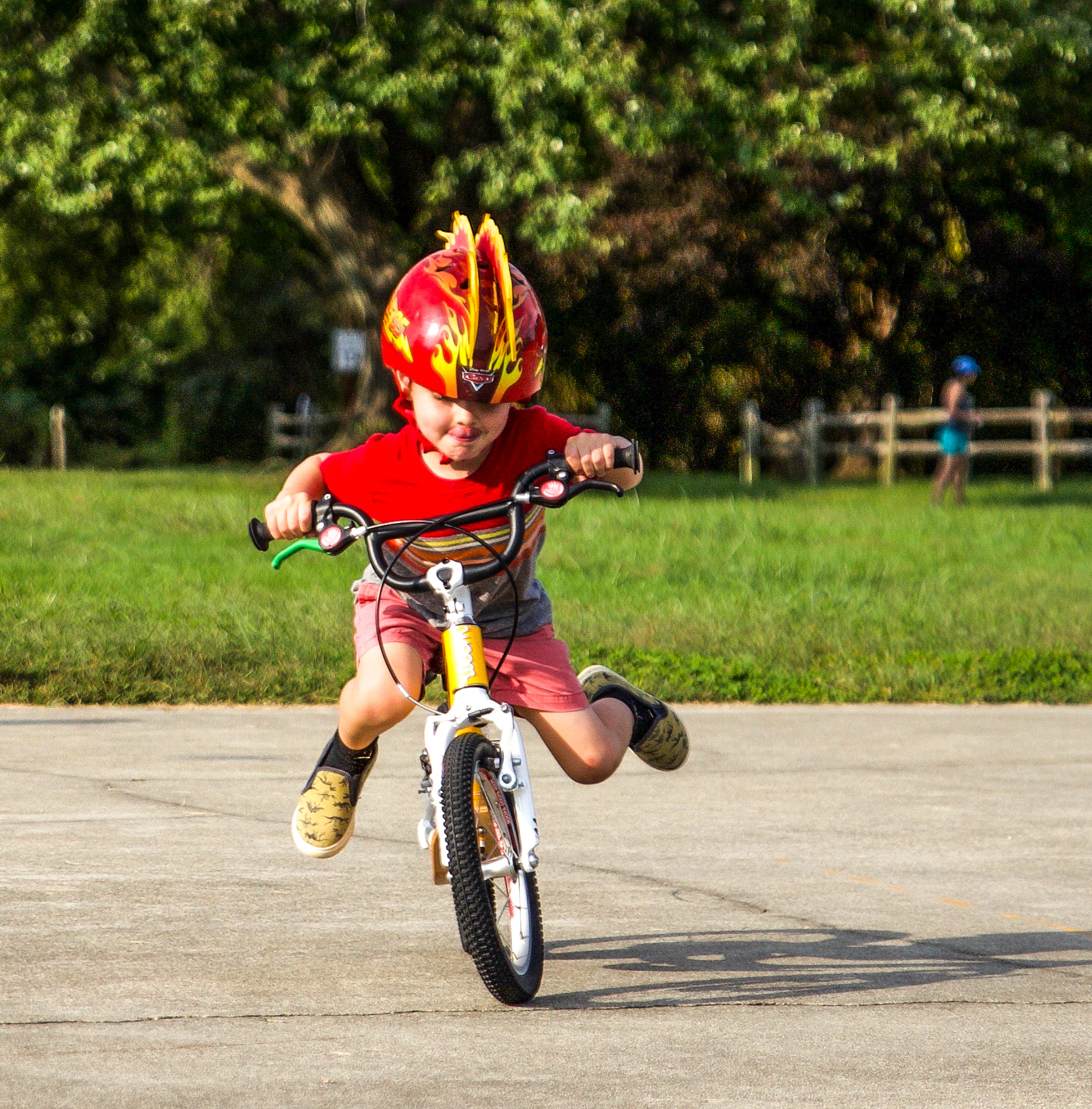 small boy driving bike