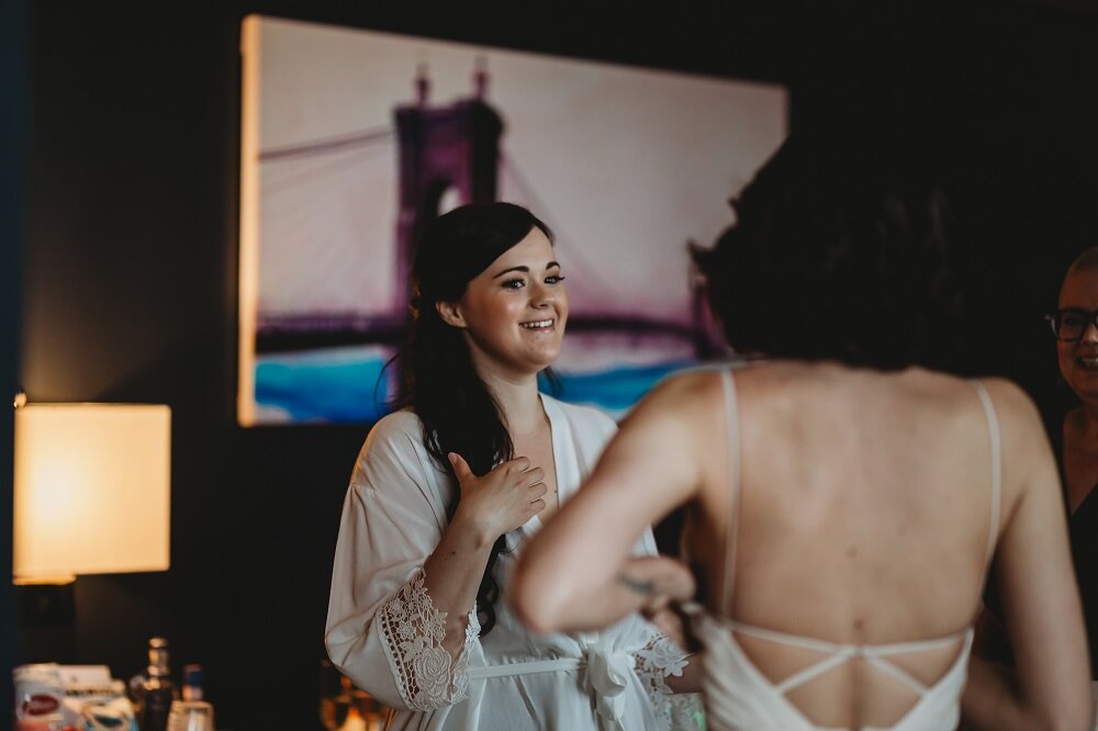 Bride and bridesmaids getting ready at hotel