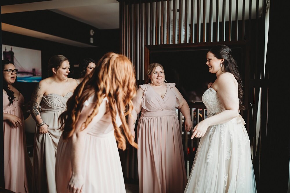 Bride and bridesmaids getting ready at hotel first look